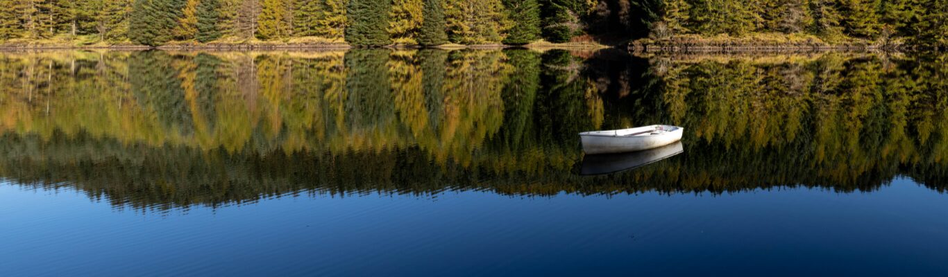 A small boat moored on still water